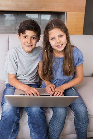 Boy and Girl at Laptop