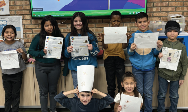 Elementary school children present their work