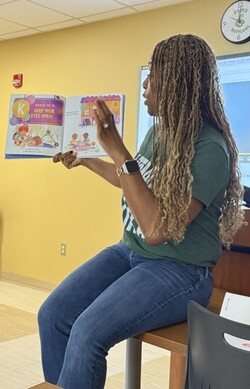Cheron H. Davis leading a read-aloud
